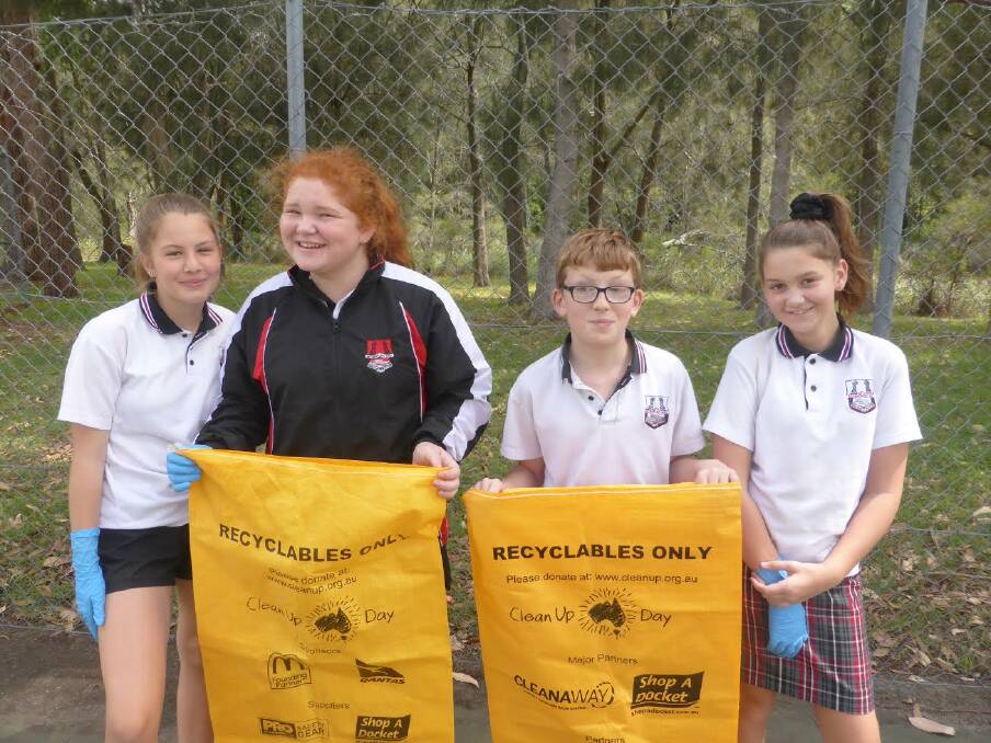 CLEANING UP: Batemans Bay High School’s student environmental council organised the schools’ Clean Up Australia Day participation in 2018, with all year 7 and some special education students getting involved. Pictured are Allyssa Jolly, Chelsea Brown, Connel McCormack and Isabelle Maguire. 