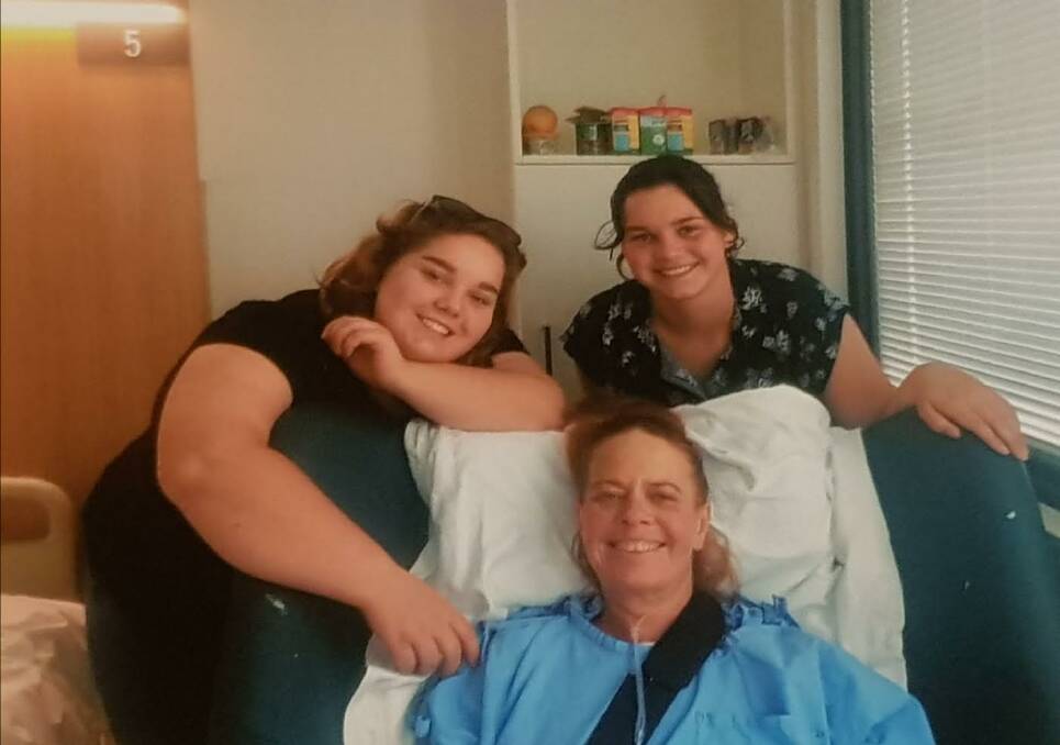 MAD MILE MIRACLE: Veronika Tuckey was lucky to survive a horror crash on the made mile, near Batemans Bay, last November. Pictured here recovering in hospital with daughters Brianna and Katrina.