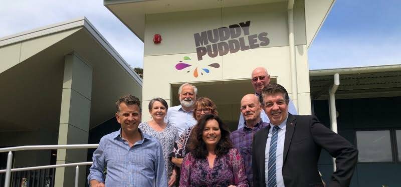 CELEBRATING: Muddy Puddles CEO Cate McMath (centre) and supporters with Bega MP Andrew Constance and Disability Services Minister Ray Williams on Thursday.