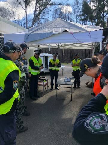 PLANNING:: Officers from across the South Coast Police District and navy personnel at the checkpoint at Timbillica. Photo: Supplied
