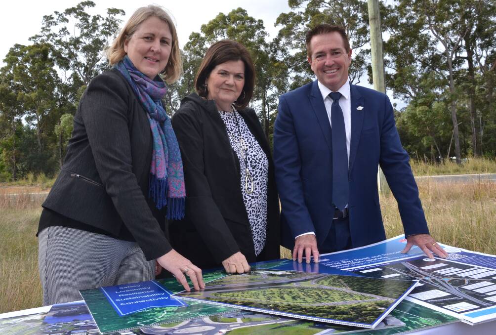 PLANS: Transport for NSW Regional Director Southern Sam Knight, South Coast MP Shelley Hancock and Minister for Regional Transport and Roads Paul Toole look over the proposals for the Princes Highway south of Nowra.
