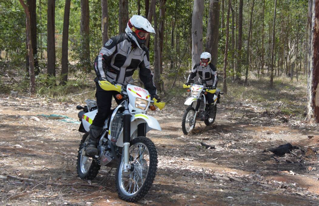 ADDED ARSENAL: Two members of the Shoalhaven RFS trail bike team Martin Copes and Mark Bourke take their new tools out for a test run. 