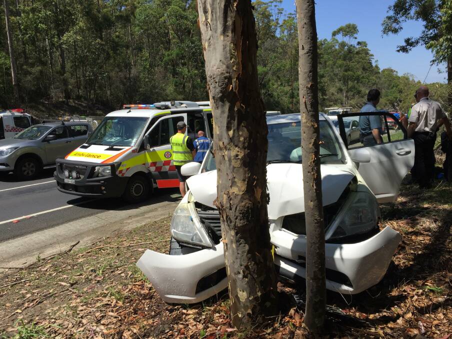 Three people were in a car that left the Princes Highway at Tomerong and crashed into a tree. Photo: Rebecca Fist
