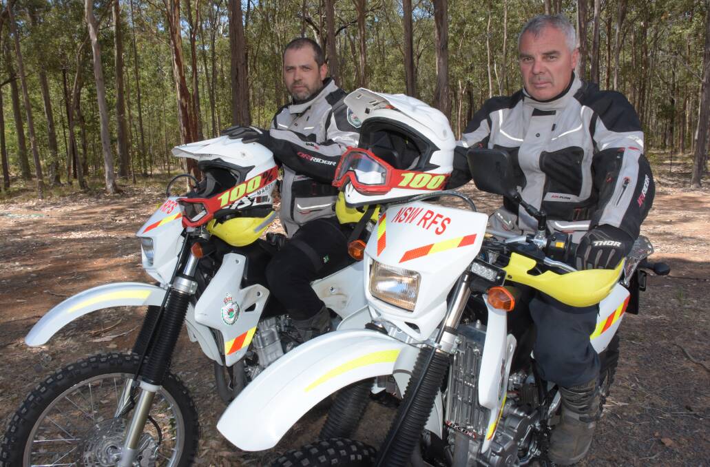 Two members of the Shoalhaven RFS trail bike team Martin Copes (left) and Mark Bourke. 