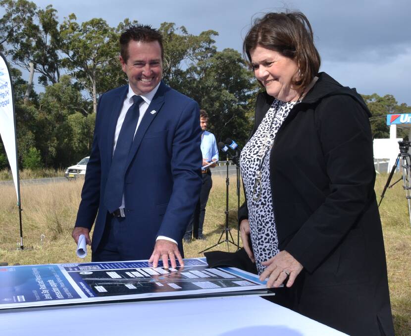 PLANS: Minister for Regional Transport and Roads Paul Toole and South Coast MP Shelley Hancock look over the proposals for the Princes Highway south of Nowra.