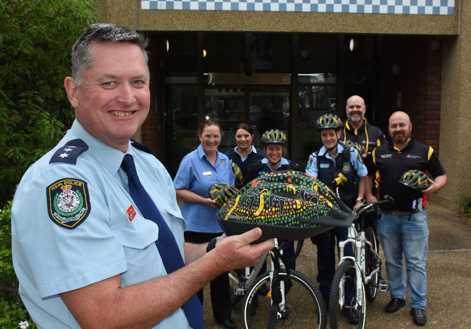 Nowra Police Station Inspector Ray Stynes with one of the new helmets when the pilot program was launched in November.