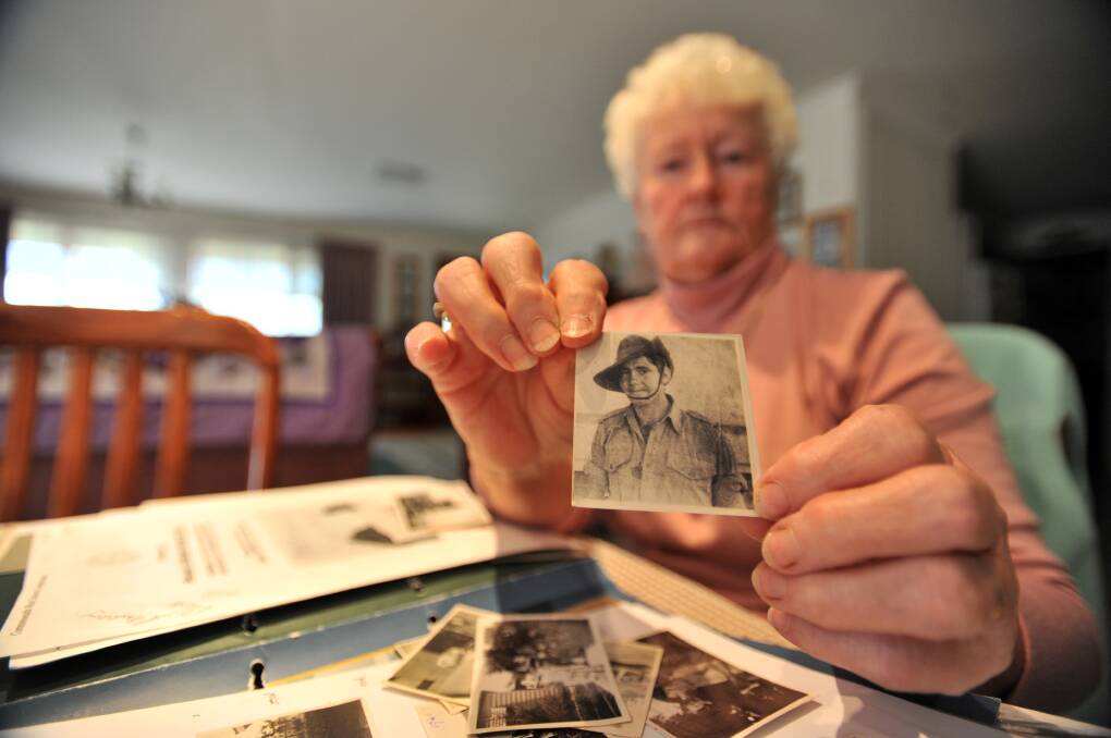 Lois Newman in 2009, showing a picture of her uncle Leonard Wall. Picture: BILL CONROY