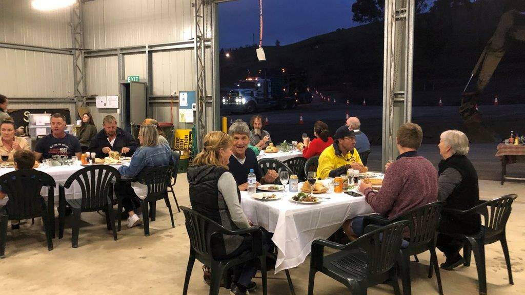 COMMUNITY SPIRIT: Fire affected Wondalga residents come together to swap stories and rekindle their community connections at a "Fire Shed Friday" event.