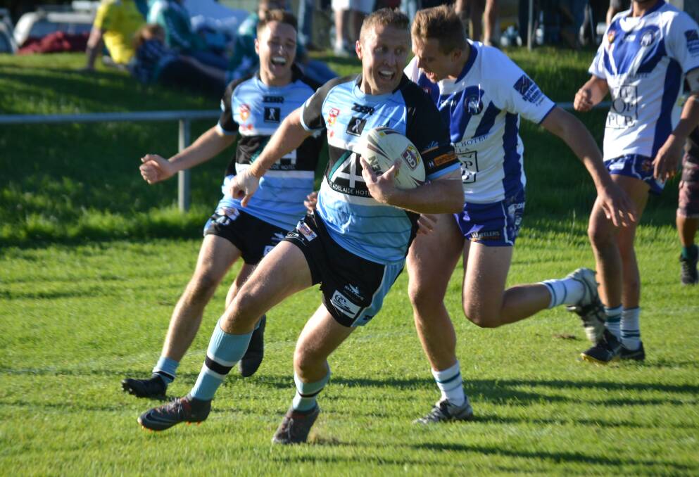 Sharks player Paddy McMahon breaks through for an easy try in the second half 