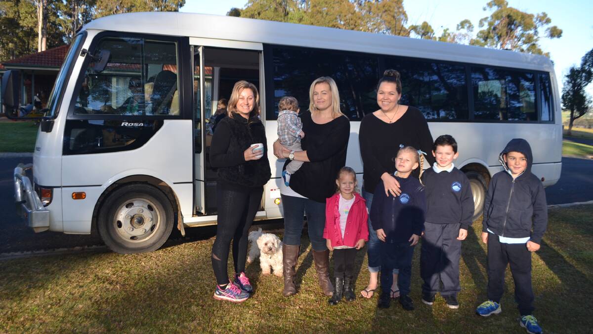 SCHOOL MUMS: Eurobodalla school mums Lee-Anne Eddie, Amy-lee Negus and Ray Stevens with kids Rhylan, Gracie, Molly, Logan and Cody and the bus without seatbelts.