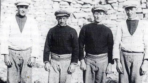Old photo of fisherman on the Aran Islands in traditional Aran sweaters.