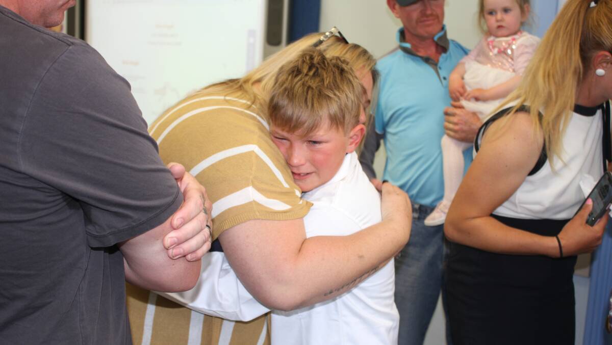 Colt Croser is congratulated by family members on Friday. Picture: Alasdair McDonald