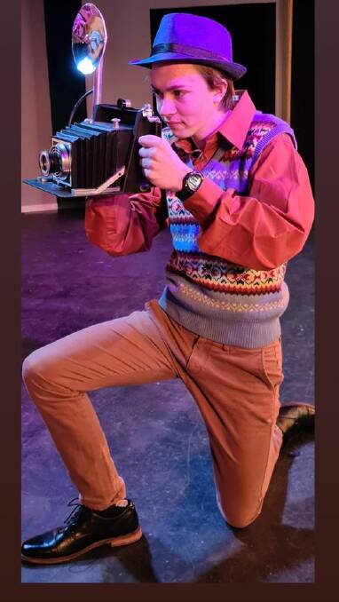 Onstage 2021: Ensemble member Sam, paparazzi of the 1920s, looking for that perfect shot in 'The Drowsy Chaperone'.
