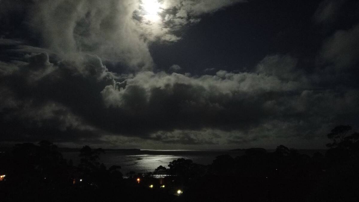Moonlight glistens off the ocean in Batemans Bay. Picture: John Hanscombe.