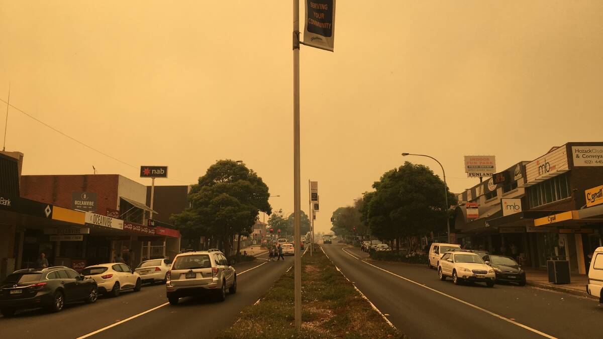 A mass of dirty yellow smoke covers Ulladulla about 10am. Picture: Sam Strong.