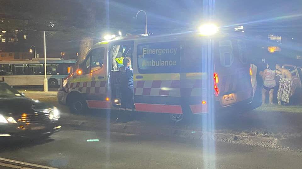 An ambulance attends City Beach at Wollongong, where two women were rescued while swimming at night on Sunday. Picture: supplied 