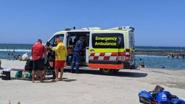 Lifesavers and paramedics responded to reports of multiple people washed across rocks after been hit by large wave on the edge of a rock platform at Woonona on Sunday. Picture: Surf Life Saving Illawarra 