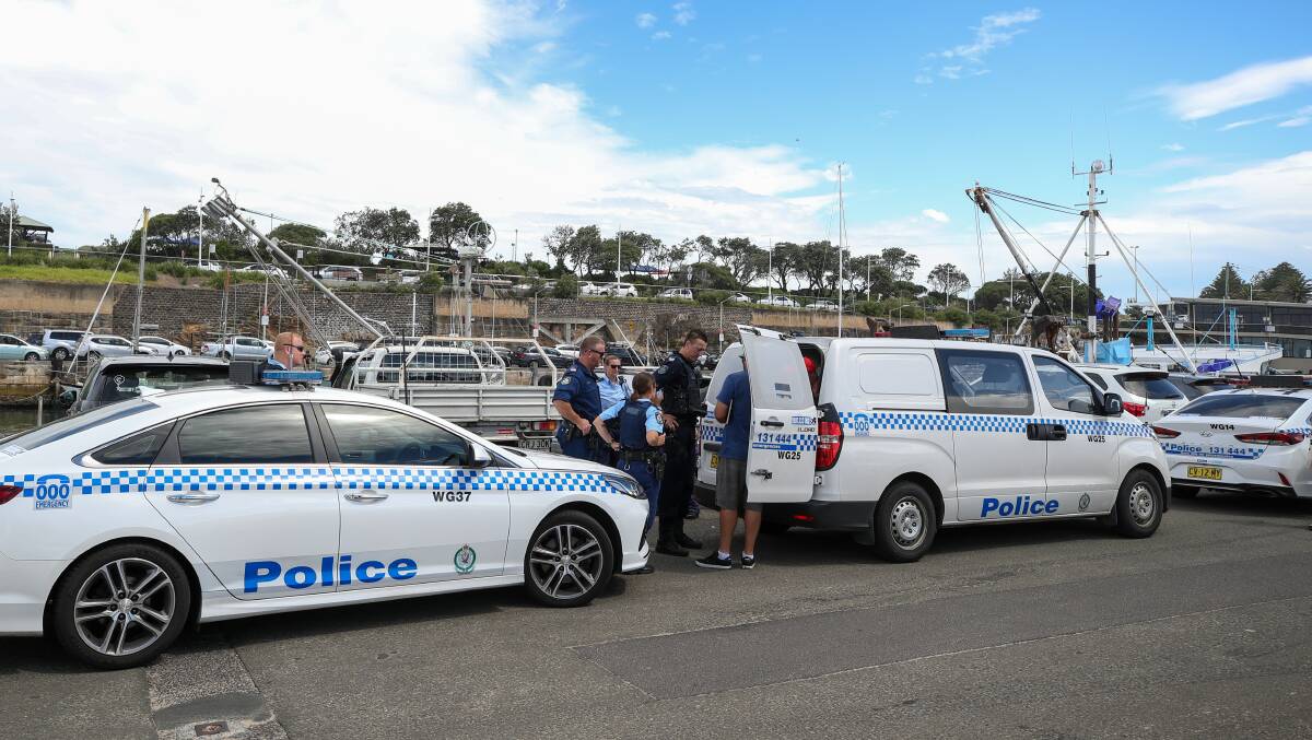 Police have charged a man who is accused of taking inappropriate photographs of children at a Wollongong beach on Australia Day. 