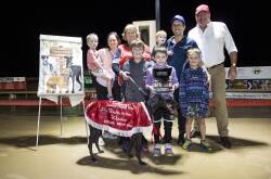 Michael and Jacqui Sheather and their boys, Maree Smith, and GRNSW CEO Rob Macaulay, celebrate the win of Bella Una in the Ladbrokes Country Classic at Dubbo. Picture: Jason McKeown.