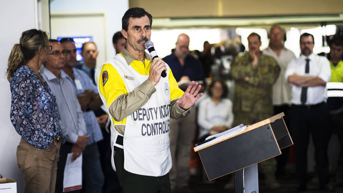 Deputy incident controller Alan Henderson speaks at a community meeting held at the Moruya Golf Club on Wednesday. Picture: Dion Georgopoulos