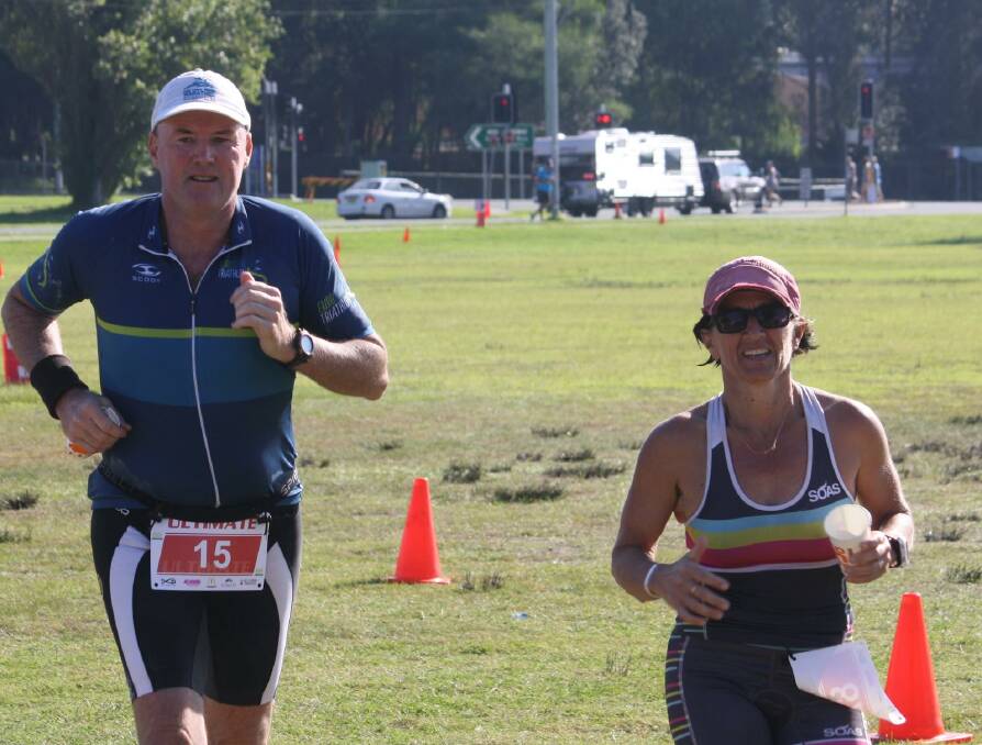 AT THE FINISH: Peter Cox and Donna Phillips cross the finish line together in the Ultimate distance race.  They both finished 3rd in their respective age groups.