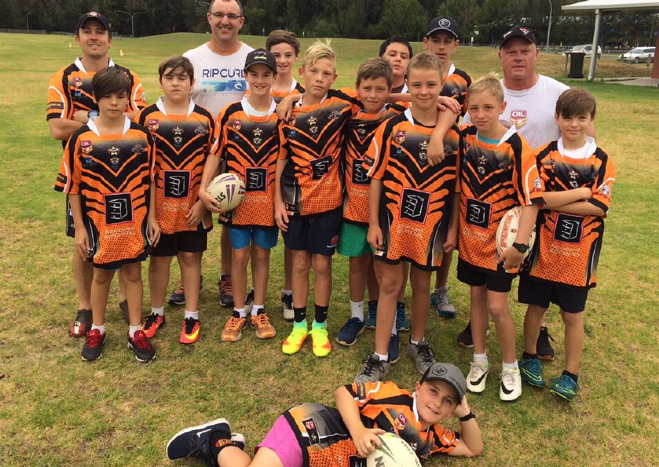 READY TO POUNCE: A selection of the Bay Tigers budding junior players with South Coast Development Officer and first grade head coach, Tim Del Guzzo (top left), at the recent NRL League Tag day.
