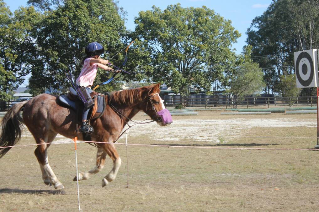 CHAMPIONS: Milly and Freckles in action at the national horse archery event.