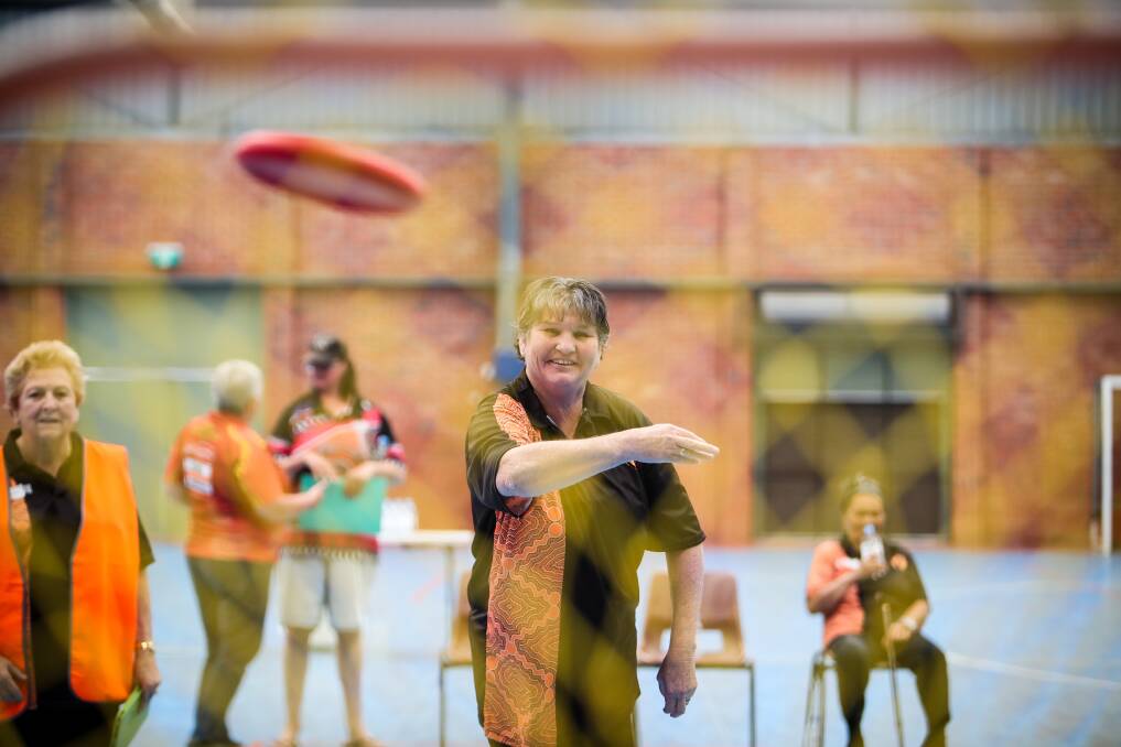Frisbee challenge: Anne-Mariee McIntosh, of Nowra, credits Aunty Jean's program for helping her manage a host of chronic health conditions. Pictures: Adam McLean