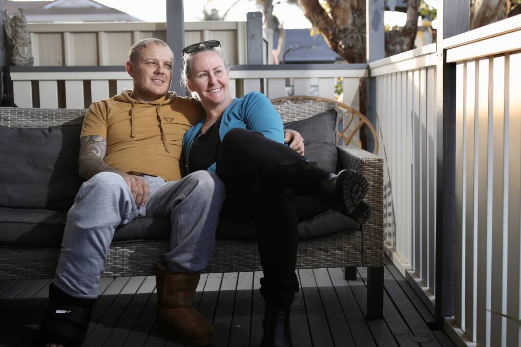 Steven Fitzgerald, with wife Nicole (left), is recovering at home after a horrific truck accident on Cambewarra Mountain last Friday. Picture: Adam McLean