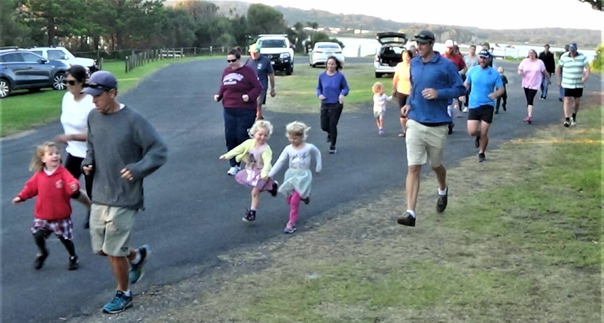 It's on for young and old: Family fun at the back of the pack during Wednesday's Broulee Runners event.
