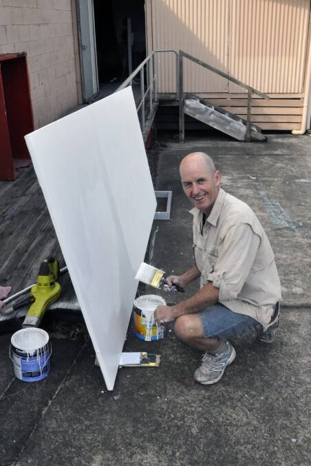 All hands on deck: Guys and Dolls' cast member Rob Devonald was part of the “small army” of volunteers  hammering, pushing and painting the set.