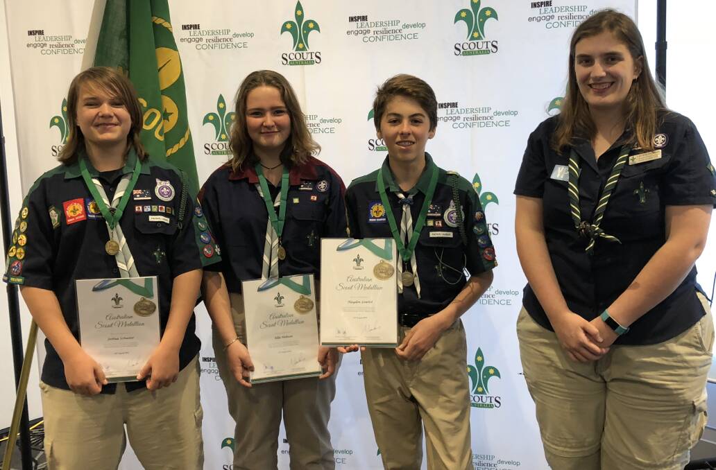 Scouts' honour: Australian Scout medallion (ASM) winners Joshua Schuster, Ella James and Hayden Louttit with Cecelia Jackson who was the first ASM recipient from the 1st Batemans Bay Scout Group in 2005.