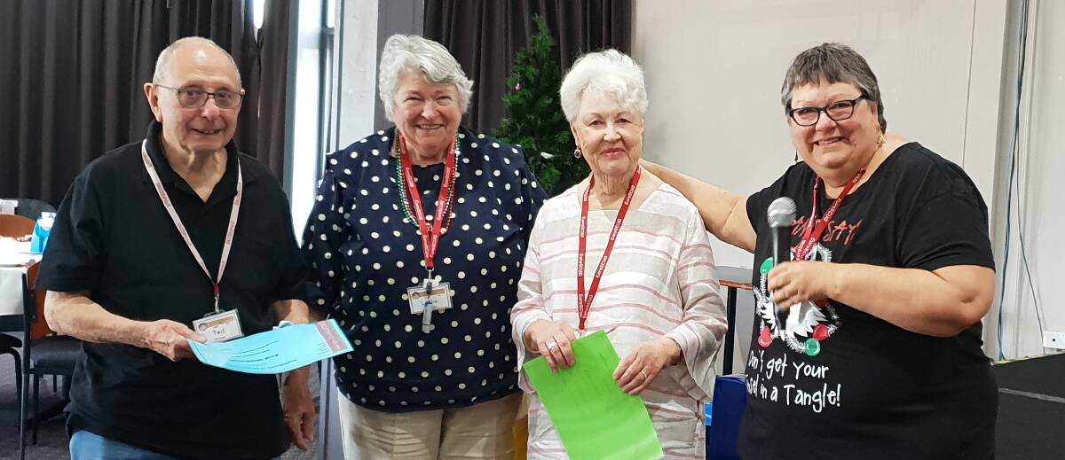 EuroSCUG president Amanda Annabel presents perfect attendance certificates to Ellen Williams, Leslie Willmouth and Ted Williams.