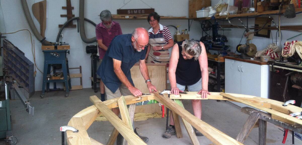 Work goes on: Peter McDowell, Rhona Jason-Smith, (back) Eric Simes and Helen Warland hard at work in Eric's workshop.
