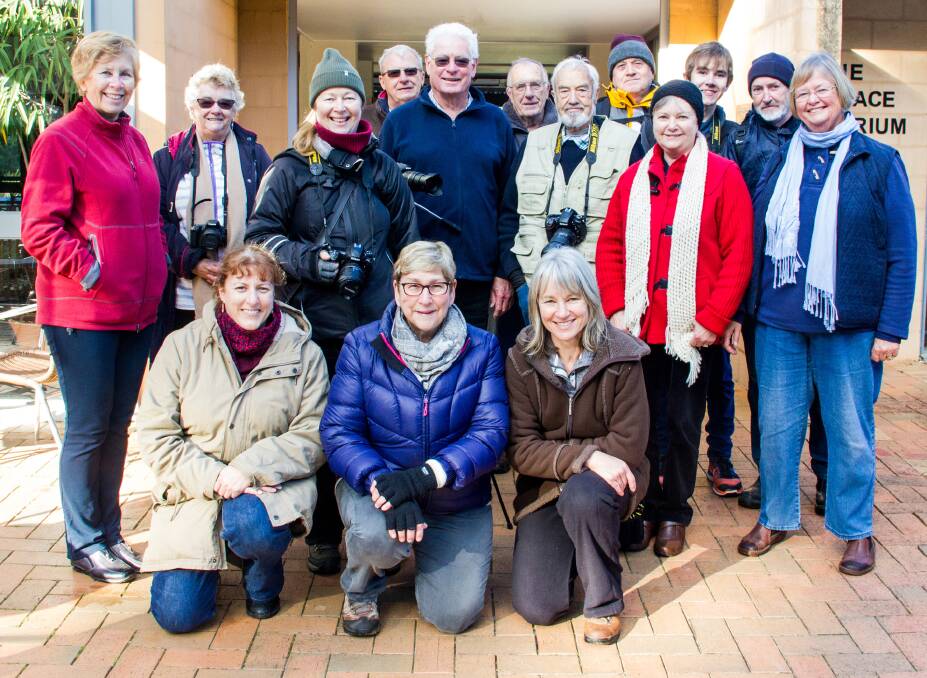 Rugged Up: Eurobodalla Photographic Club members brave the cold at Eurobodalla Regional Botanic Garden.