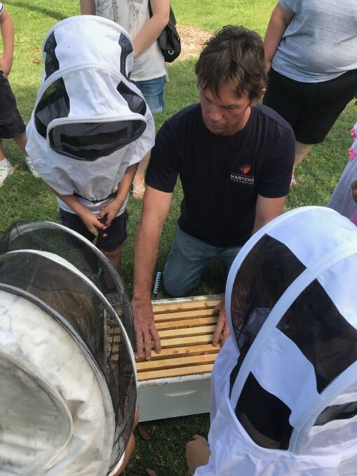 What's the buzz?: Andrew from The Shoalhaven Beekeepers Association explained the art of beekeeping to children during a visit to UOW Nowra hosted by The South Coast Sub-branch of Gifted Families Support Group. 