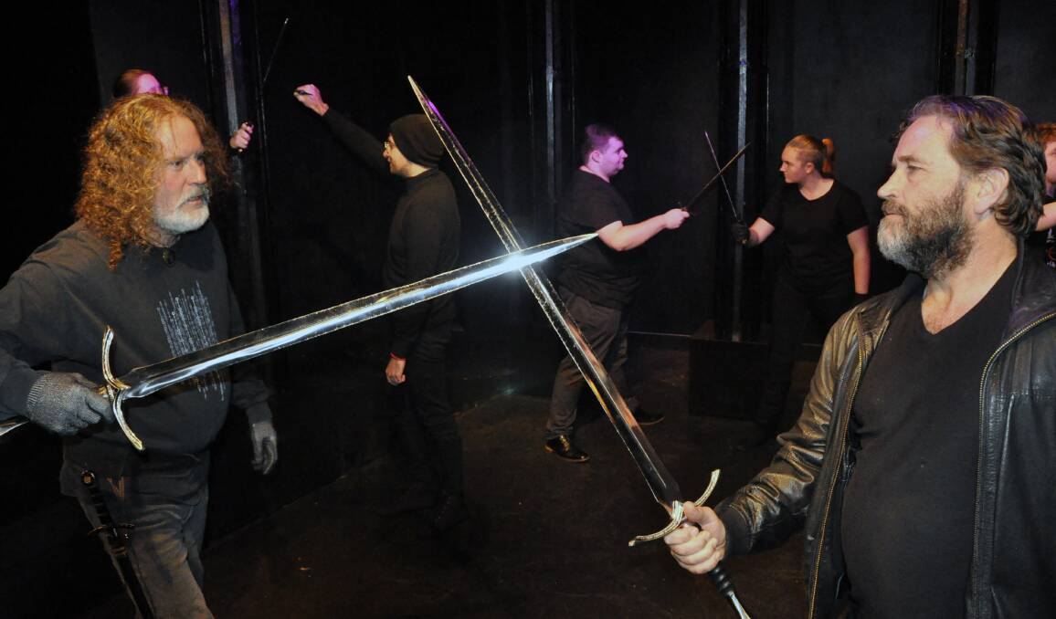 Swordplay: Bill Douglas (Macbeth) with Jeremy Kemp (McDuff) practising their sword fighting skills in rehearsal.