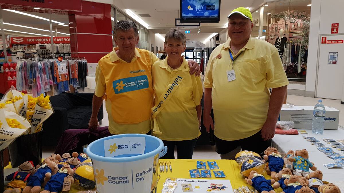 Manning the Daffodil Day stand are Graham Johnson, Kerrie Johnson and Brad Rossiter.