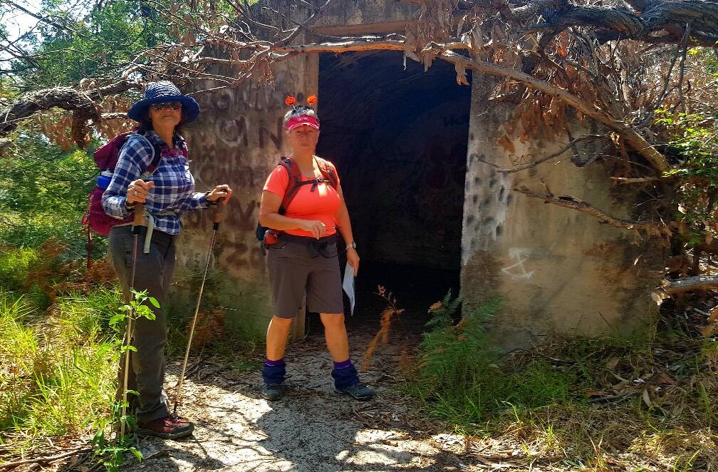 Happy Halloween: Denise Strickland and walk leader, Ros Marion checking out the WWII Radar Station Number 17 at Guerilla Bay.
