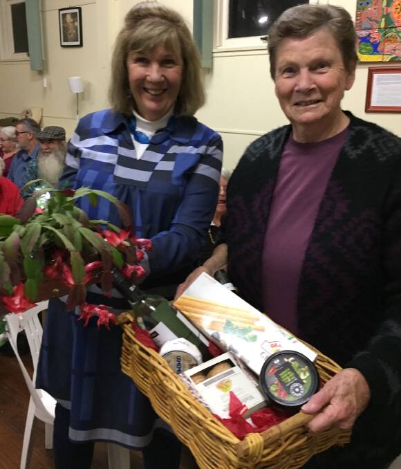Fashionistas: The lucky winners of the door prize and the raffle at The Crazy Whist Night in Moruya Mechanics Hall last week, Rosemary Brown with her basket of goodies and Liz Fisher with her beautiful plant.