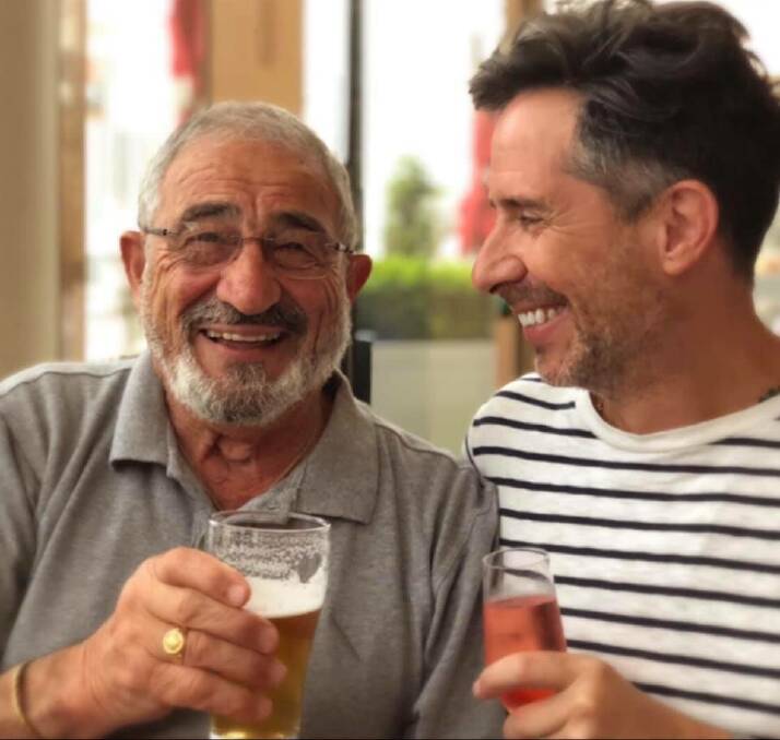 HERE'S CHEERS: Anthony Nader, hairdresser to the stars, has a beer with his Dad John Nader to celebrate his 81st birthday. John is a Moruya icon.