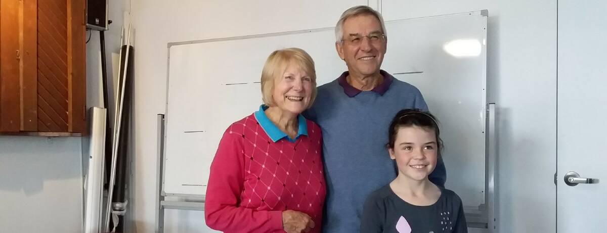 Tuross Head Vets Golf: Kaye Lunt (second place) and Ian Manton (winner) with special visitor, Emily, after Wednesday's single stableford event.