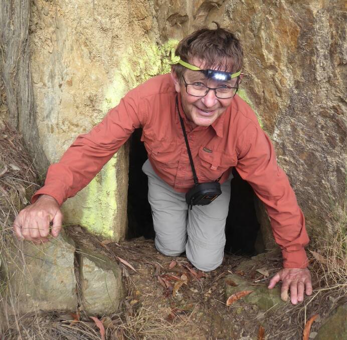 Underground adventure: Batemans Bay bushwalker, Barry Keeley, emerges from a mine shaft during the group's trip to Nerrigundah historical sites.