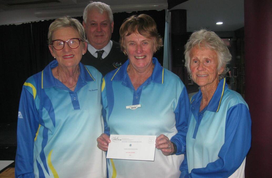 Malua Bay Women's bowls: Club Malua CEO Peter Cook presenting 1st day winners at the weekend triples carnival, Pat Weekes, Gwen Ware and June Williams .