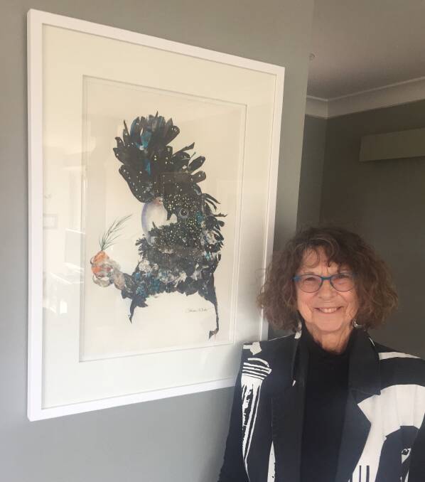 Birds of a feather: Gillian Wilde in her studio with A Galaxy in her Feathers, watercolour and collage on paper.