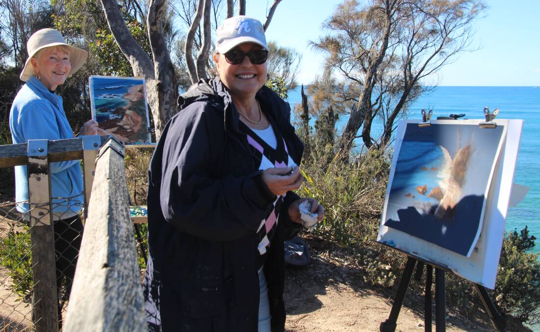 Feel the serenity: Lyn Woolridge (left) and Robyn Dixon get some fresh air while painting in a "Plein Air" session recently.