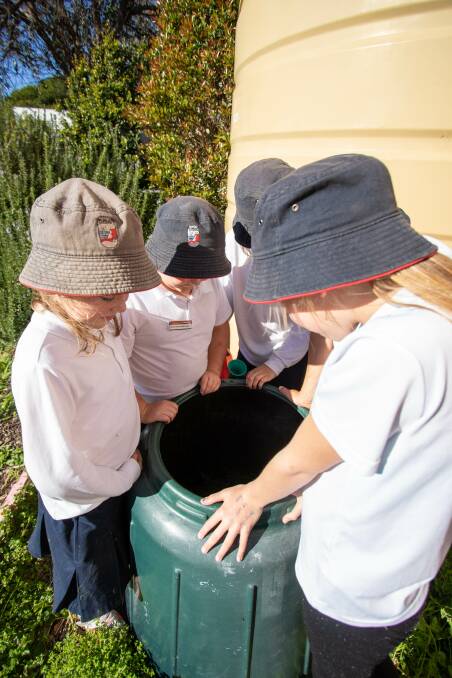 Learning good habits: By composting in the school veggie patch, Narooma Public students are saving water and recycling to get behind National Recycling Week. 