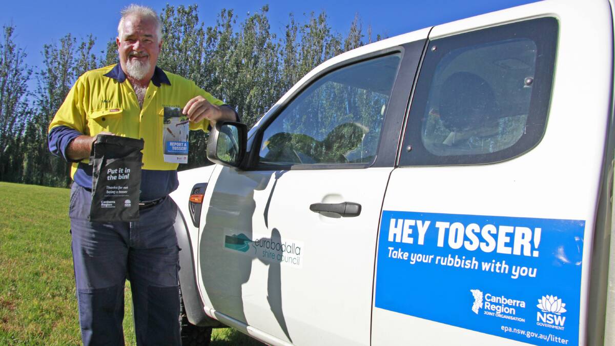 Eurobodalla Shire Council invasive species officer Mick Johnson with the free litter bags available at service stations, visitor information centres and other visitor hotspots as part of the Hey Tosser campaign. 