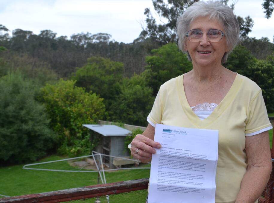 CLEAN SHEET: Batemans Bay resident Davida MaChing with her letter from Eurobodalla Shire Council.
