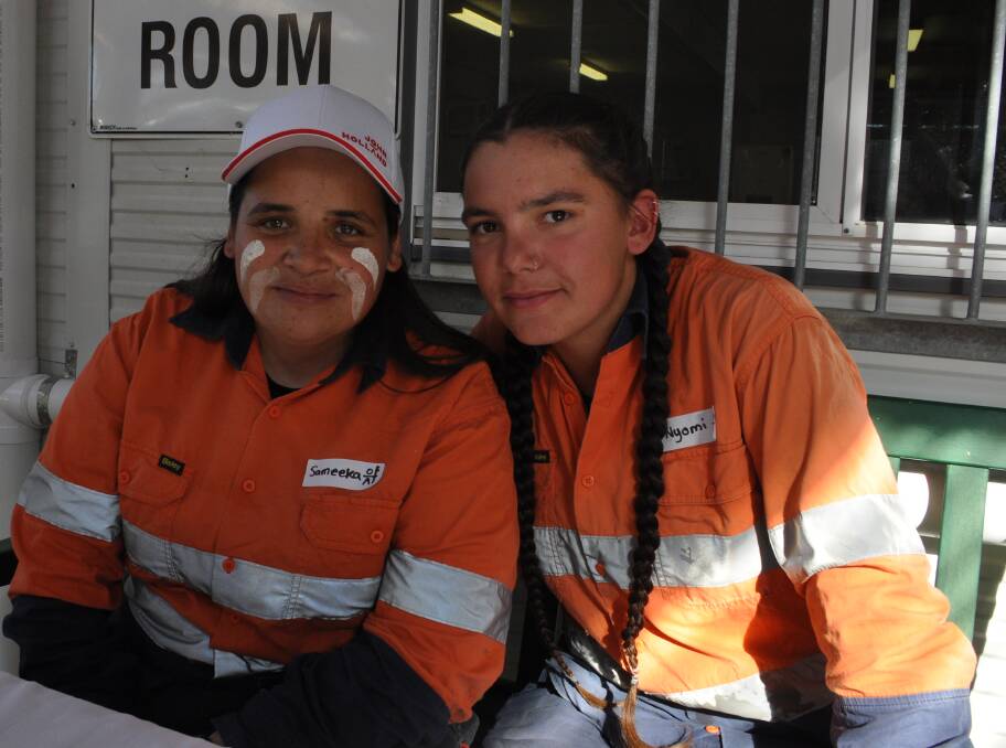  Trainees Sameeka Wighton and Nyomi Nye at the project site on July 12.